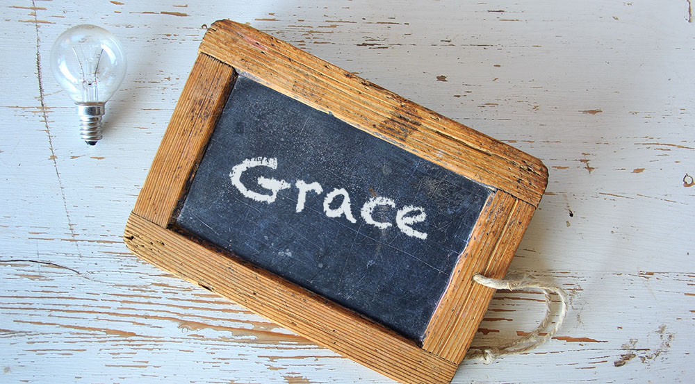 blackboard with the word Grace written on it